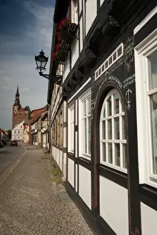 Saxony Anhalt Prints: Historical Gothic style burgher houses along Kirchstrasse Street and Church of St