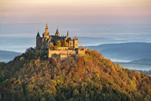 Typically German Gallery: Hohenzollern castle in autumnal scenery at dawn, Hechingen, Baden-Wurttemberg, Germany