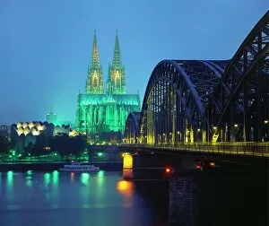 19th Century Gallery: Hohenzollernbrucke and the Cathedral Illuminated at Night, Cologne, Germany