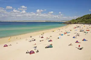 Holidaymakers and tourists sunbathing on Porthminster beach, St. Ives (Pedn Olva)