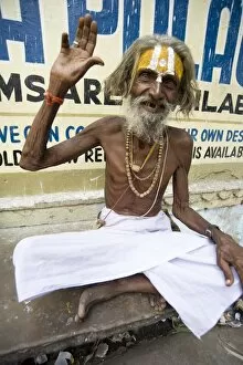 Images Dated 17th October 2009: Holy man (Saddhu) with red cotton rolimoli on wrist and tilak mark on forehead denoting devotion
