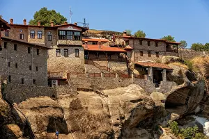 Balconies Prints: Holy Monastery of Varlaam built on rock formations with stone structures overlooking the valley in Meteora