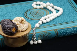 Black Background Prints: Holy Quran book with prayer beads and date, Ramadan concept, Muslim faith and religion