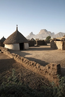 Homes lie in the shadow of Taka Mountain in the town of Kassala