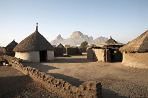 Homes lie in the shadow of Taka Mountain in the town of Kassala