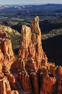Hoodoo Prints: Hoodoos lit by late afternoon sun with distant view in winter