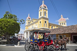 Horse cart passing Cathedral de Granada, Park Colon (Park Central), Granada Horse cart passing Cathedral de Granada, Park Colon (Park Central), Granada