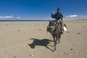 Horse rider at Karakul Lake, Karakul, Tajikistan, Central Asia, Asia
