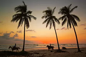 Images Dated 21st December 2009: Horse riders at sunset, Playa Guiones surfing beach, Nosara, Nicoya Peninsula