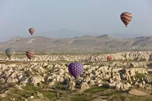 Hot air balloon flight over the famous volcanic tufa rock formations around Goreme