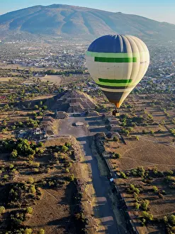 Enchanting Prints: Hot air balloon flying over the Avenue of the Dead and the Pyramid of the Moon at sunrise