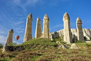 Asia Minor Prints: Hot air balloon over the phallic pillars known as fairy chimneys in the valley known as Love Valley near Goreme