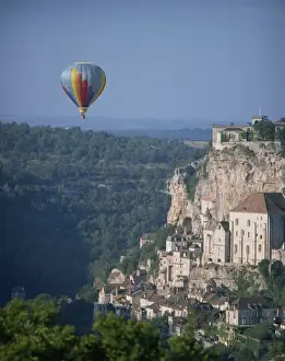 Hot air balloon above the valley at Rocamador in the Dordogne area of the Midi Pyrenees