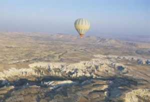 Arid Landscape Prints: Hot air ballooning over rock formations