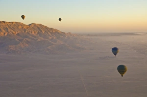 Images Dated 17th December 2008: Hot air balloons on an excursion flying over the desert early morning at dawn