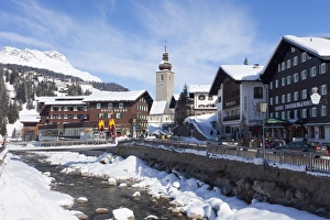 Lech Prints: Hotel Krone, river and village church, Lech near St. Anton am Arlberg in winter snow