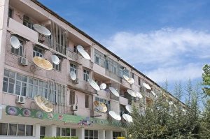 House block in the old Soviet style with satellite dishes, Ashgabad, Turkmenistan House block in the old Soviet style with satellite dishes, Ashgabad, Turkmenistan