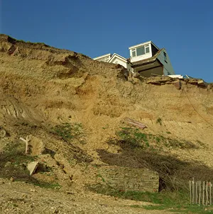 Surface Processes Prints: House about to topple over cliffs, Barton-on-Sea, Hampshire, England, United Kingdom