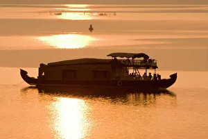 Silhouettes Prints: Houseboat at dusk in Ashtamudi Lake, Kollam, Kerala, India, Asia