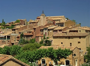 Roussillon Prints: Houses and church tower on the skyline in the village of Roussillon, Vaucluse