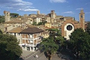 Houses, churches and towers in the town of Passignano