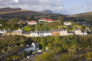 Images Dated 6th October 2009: Houses on hillside overlooking the harbour, the Storr visible on horizon