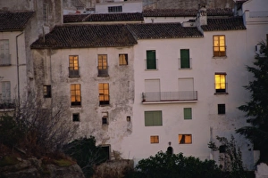 Ronda Prints: Houses in La Ciudad, old Moorish quarter, lit up by the sunset, Ronda, Andalucia