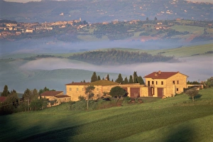 Pienza Prints: Houses in a misty landscape near Pienza