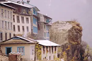 Everest Region Prints: Houses and painted Sutras (Mahayana Buddhist scriptures) on a rock