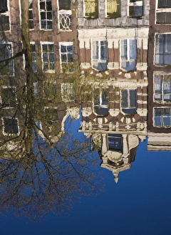 Houses reflecting in the water, Singel Canal, Amsterdam, Netherlands, Europe