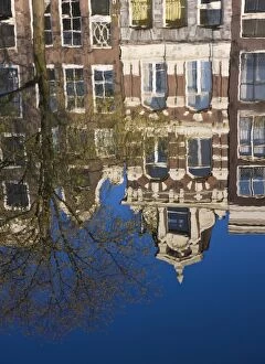 Houses reflecting in the water, Singel Canal, Amsterdam, Netherlands, Europe