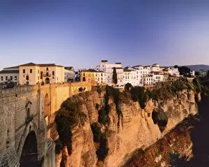Images Dated 23rd September 2008: Houses on the Tajo edge and the bridge Puente Nuevo, old town of Ronda at sunset, Province Malaga
