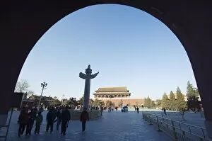 a Huabiao statue under an arch of the Gate of Heavenly Peace between the Forbidden City