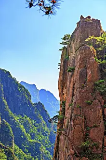 Province Prints: Huangshan Mountain area with steep cliffs and trees under a clear sky in Anhui Province
