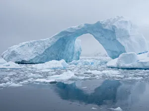 Natural Arch Prints: A huge arch formed in a tilted iceberg in Cierva Cove, Antarctica, Polar Regions
