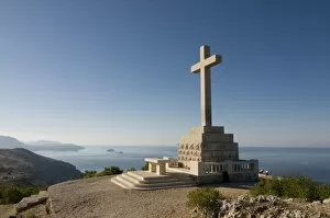 Huge Christian cross on top of the mountain above the old town of Dubrovnik