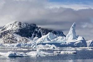 Snowcapped Prints: Huge iceberg amongst sea ice in the Yalour Islands