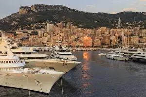 Luxury Prints: Huge super yachts in the glamorous Port of Monaco (Port Hercules) at sunrise, from the sea