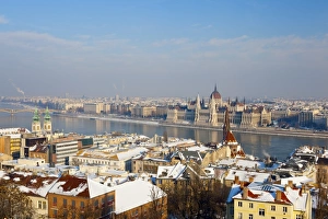 Images Dated 21st December 2009: Hungarian Parliament illuminated by warm light on a winters afternoon, Budapest, Hungary, Europe