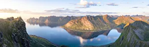 Troms County Prints: Husfjellet mountain reflected in the blue water of Ersfjord