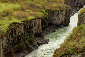 Hues Prints: Hvit River flows through basalts with autumn colors in Iceland's canyon landscape