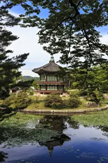 Typically Korean Prints: Hyangwonjeong, hexagonal pavilion reflected in water lily filled lake in summer