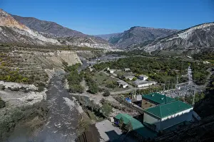 Ecology Prints: Hydro power station located by Karakoisu river in Dagestan shows infrastructure and landscape under clear sky