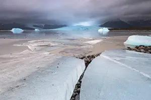 Glacial Prints: Ice Blocks at Fjallsarlon Iceberg Lagoon backed by the Fjallsjokull Glacier