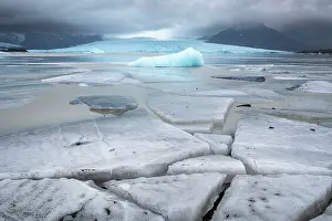 Stillness Prints: Ice Blocks at Fjallsarlon Iceberg Lagoon backed by the Fjallsjokull Glacier