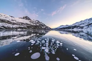Engadine Prints: Ice bubbles trapped in Lake Sils with Piz Lagrev in background, Engadine