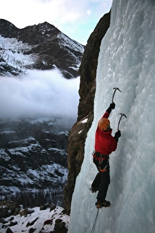 Reach Prints: An ice climber makes his way up a frozen waterfall near Cogne, above the Aosta Valley