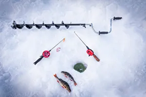 Fishing Rod Prints: Ice drill, fishing rods and catch of fish close to ice hole
