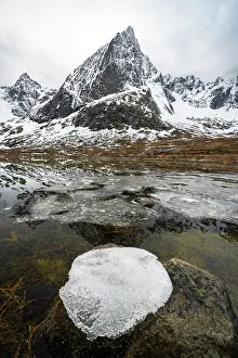 Sheet Prints: Ice formation on top of a rock in the Arctic landscape