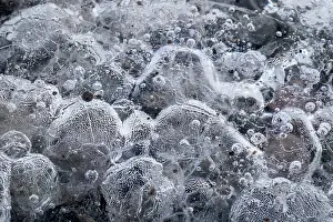 Crystal Prints: Ice Patterns and Air Bubbles within Ice Blocks at Fjallsarlon Iceberg Lagoon
